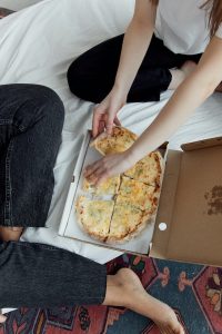 eating online delivered pizza